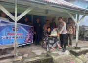 Polres Kuansing Gelar Minggu Kasih Pemberian Bansos di Desa Jake