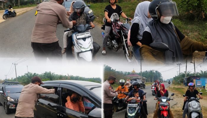 Polsek Rambah Hilir Bagikan Masker Ke Masyarakat Cegah Dampak Kabut Asap
